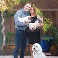 Couple Portrait - Custom Art | Personalized Painting featuring a smiling couple holding pets in a backyard setting, perfect for pet lovers.
